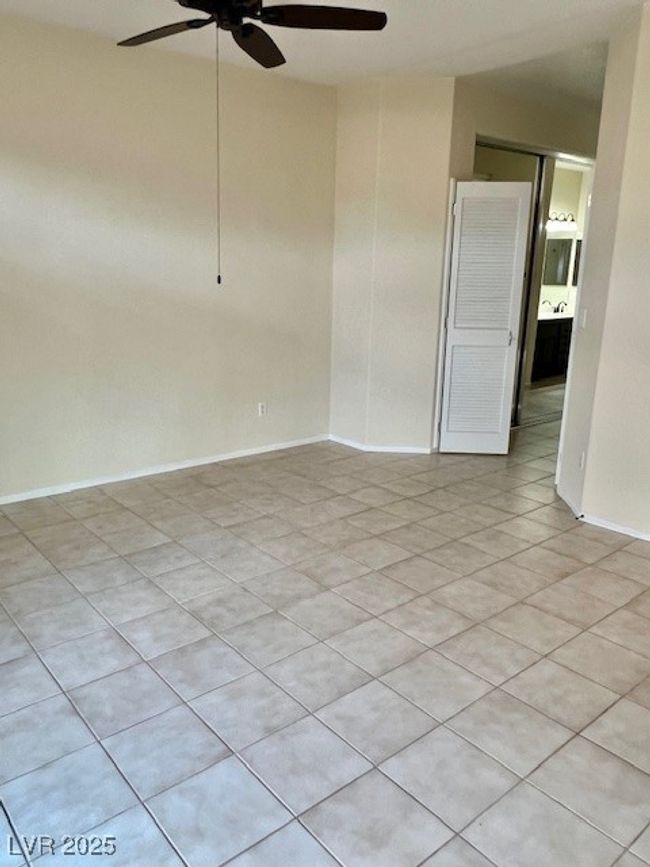 Bathroom featuring toilet, baseboards, and tile patterned flooring | Image 18