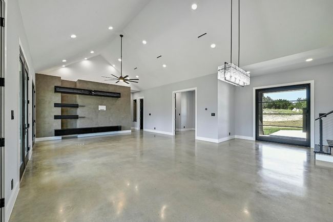 Step through the oversized designer glass front door into an entry foyer that opens onto the majestic great room open floor plan. | Image 9