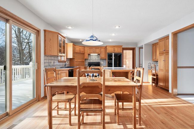 The eat-in kitchen is spacious and the floors are beautifully refinished. | Image 8