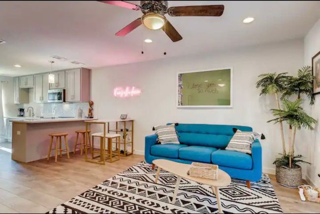 Living room with ceiling fan, light wood-style floors, recessed lighting, and baseboards | Image 10