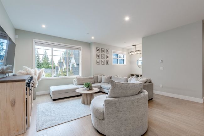 Living area with recessed lighting, baseboards, and light wood-type flooring | Image 5
