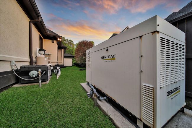 This 6, 086 square foot estate is equipped with a powerful 45kW Generac Guardian Series backup generator, providing peace of mind and whole-house coverage during unexpected power outages. Professionally installed and strategically integrated with the home’s mechanical systems, this highly coveted amenity ensures seamless, automatic operation to keep essentials running smoothly, offering both security and comfort for your family when it matters most. | Image 40