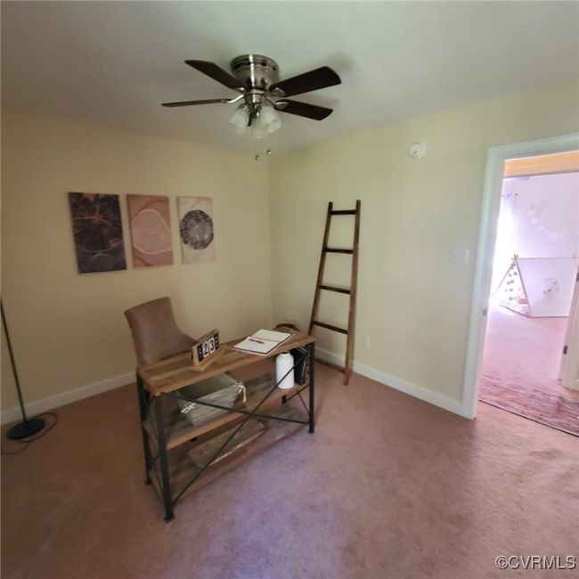 Home office featuring ceiling fan, baseboards, and light carpet | Image 47