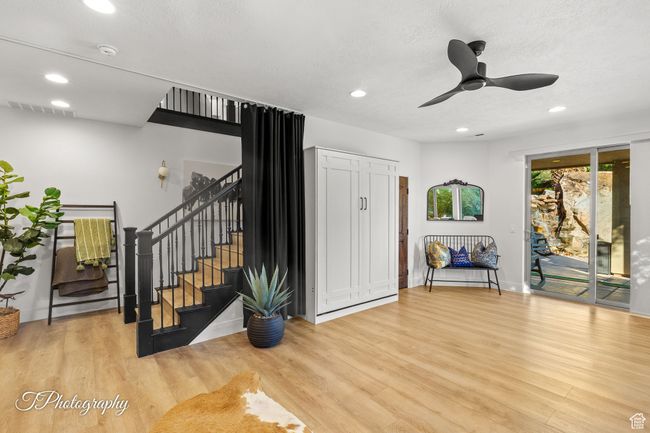 Foyer featuring stairs, wood finished floors, recessed lighting, ceiling fan, and baseboards | Image 40