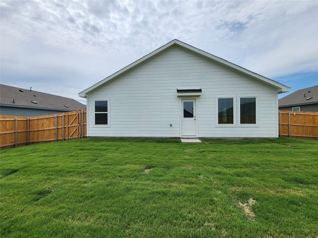 Rear view of property with a fenced backyard | Image 12