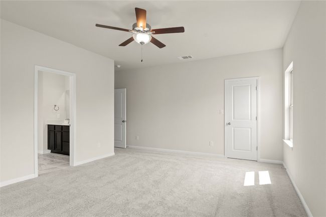 Spare room featuring ceiling fan and light colored carpet | Image 21