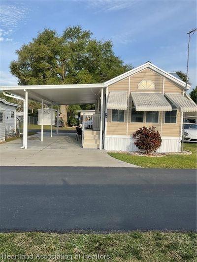 Front view awnings and oversized driveway | Image 1