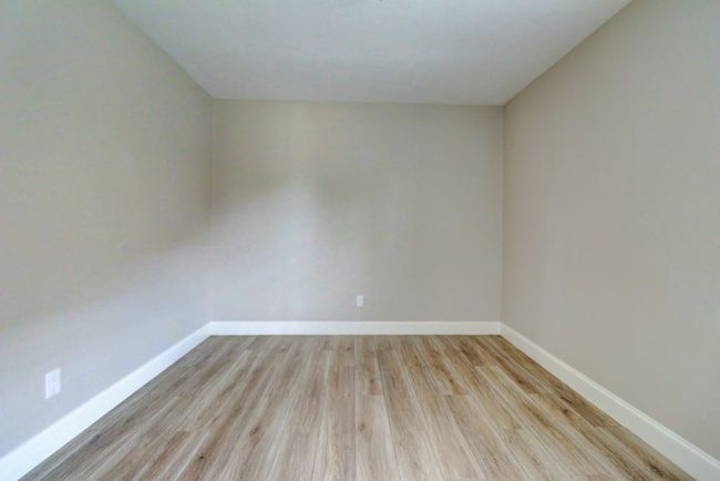 Empty room featuring wood finished floors and baseboards | Image 23