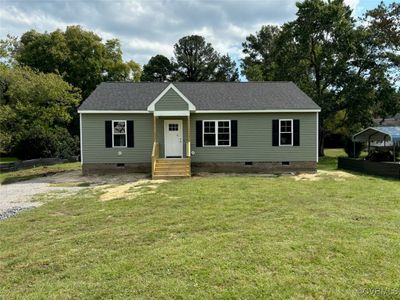 View of front facade featuring a front lawn | Image 1