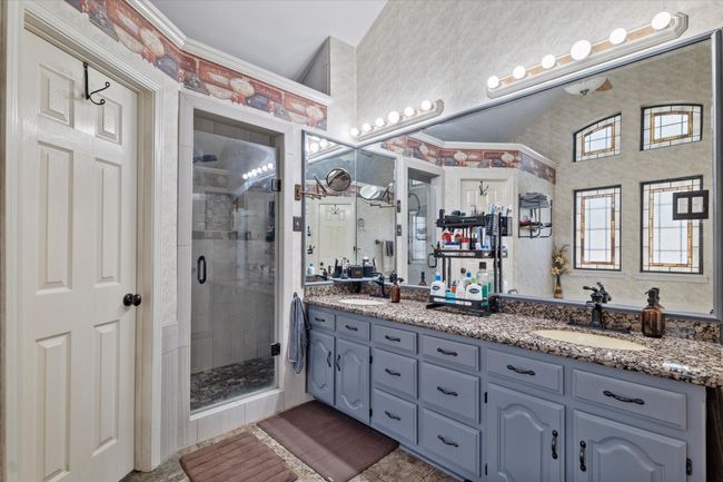 Bathroom with double vanity and a stall shower | Image 23