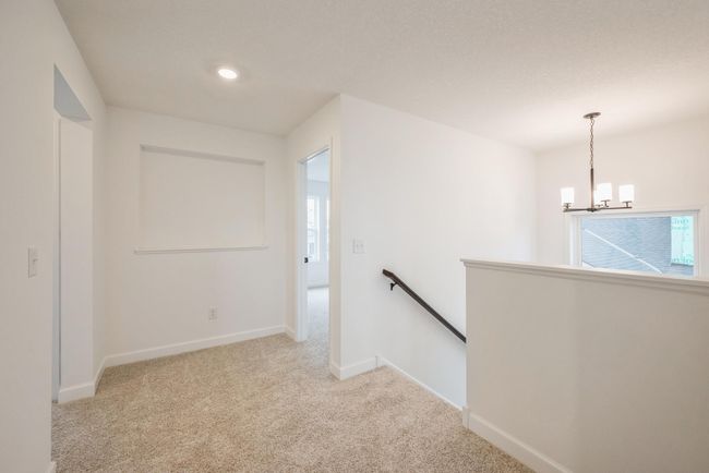 Photo is of the actual home. Upper level landing. | Image 8