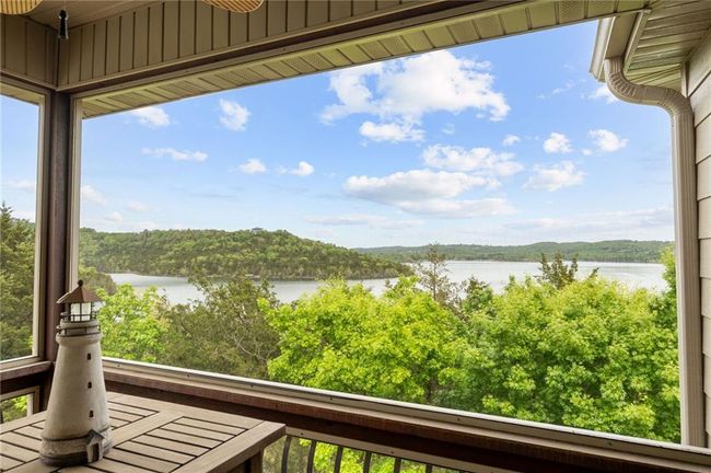 Balcony featuring a water view and a forest view | Image 7