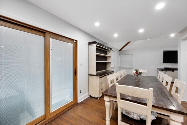 Dining room featuring recessed lighting, lofted ceiling, baseboards, and dark wood-style floors | Image 10