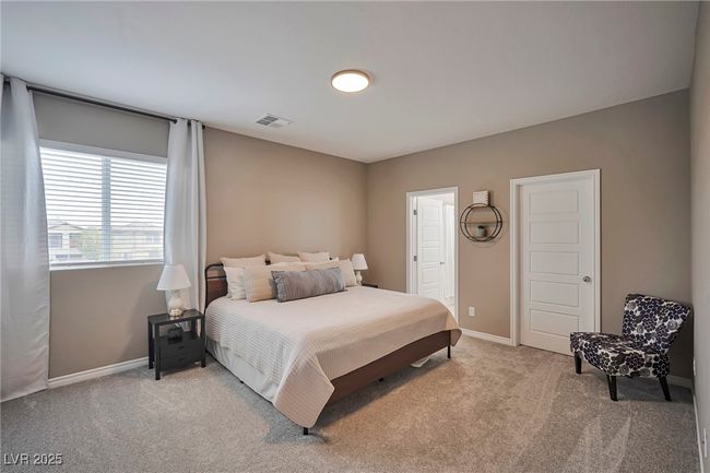 Bedroom with light carpet, baseboards, and visible vents | Image 26