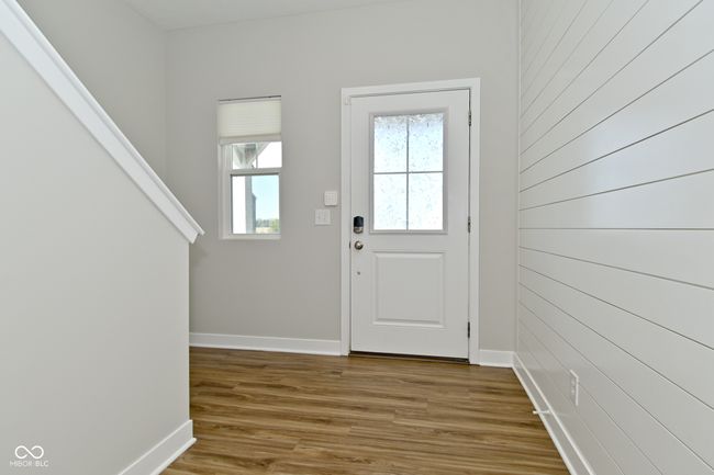 entryway with wood finished floors and baseboards | Image 4