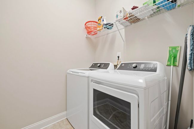 Washroom with separate washer and dryer and baseboards | Image 27