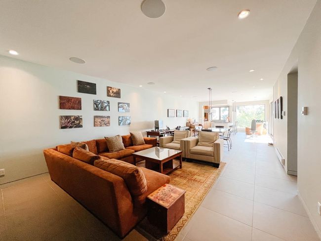 Living room featuring light tile patterned flooring and recessed lighting | Image 21