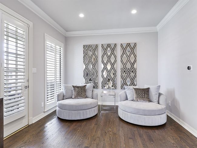 Sitting room with wood finished floors, crown molding, and recessed lighting | Image 21