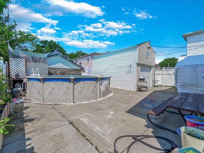 Rear view of property featuring an outbuilding | Image 33