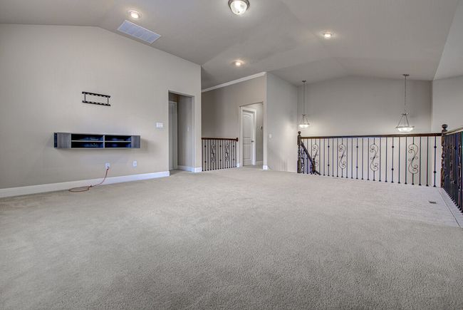 Spare room with lofted ceiling and carpet | Image 18