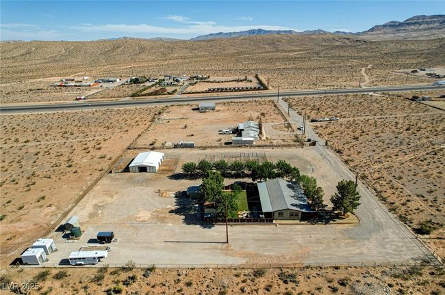 Aerial view of sparsely populated area featuring mountains | Image 61
