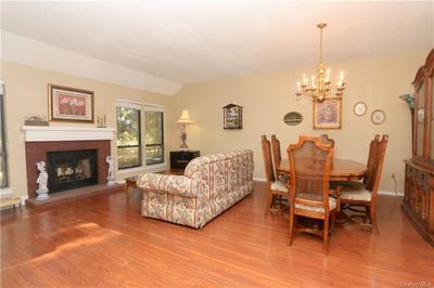 The living room is open to the dining area. | Image 3