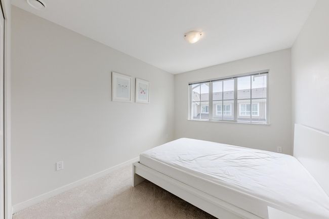 Bedroom featuring carpet floors and baseboards | Image 21
