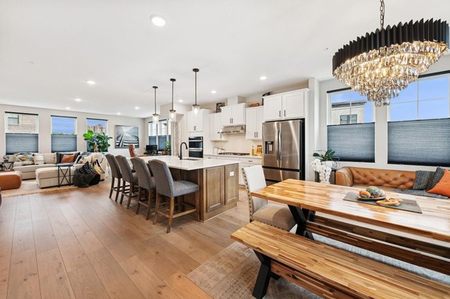 Open-concept family, dining, and kitchen area on the main floor—perfectly designed for entertaining and cooking together. | Image 23