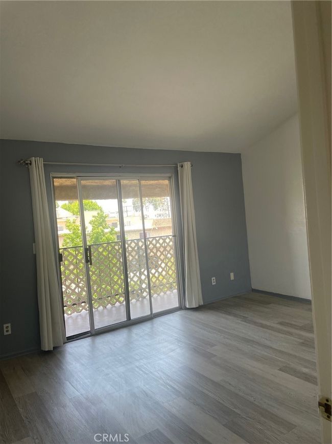Bedroom view to exit sliding door to balcony | Image 8