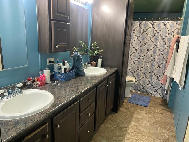 The master bathroom has double sinks | Image 9