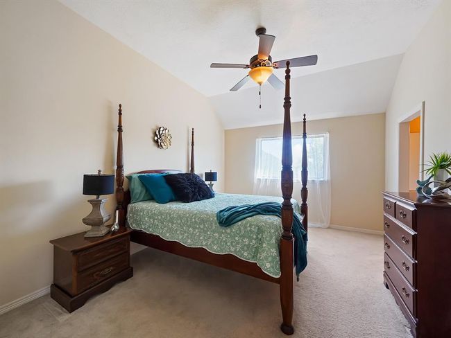 Cozy third bedroom with natural light and ample space for comfort. | Image 43