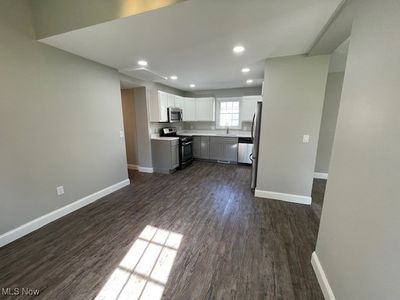 Kitchen with stainless steel appliances, white cabinetry and quartz counters | Image 3