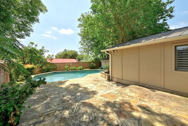 Rear patio - and check out the metal roof that was installed to replace the shingle roof | Image 18