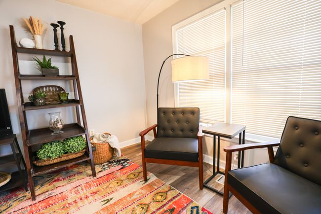 Living area with baseboards and wood finished floors | Image 7