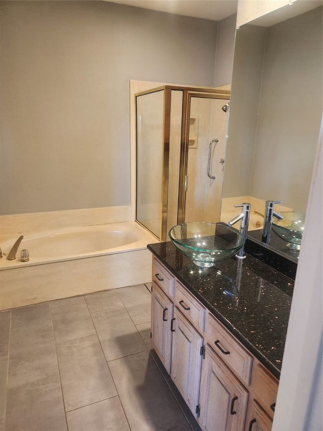 Full bathroom with a bath, tile patterned flooring, vanity, and a shower stall | Image 9