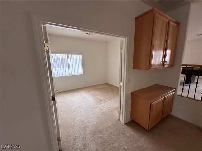 Spare room featuring light colored carpet | Image 11