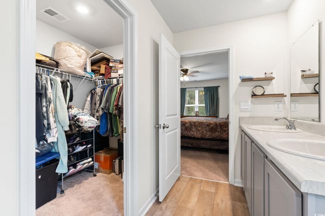 Bathroom featuring vanity, hardwood / wood-style floors, and ceiling fan | Image 20