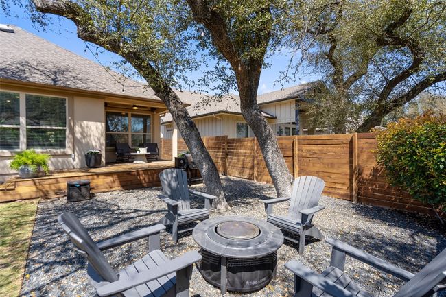 Fenced backyard featuring a fire pit and a patio | Image 34