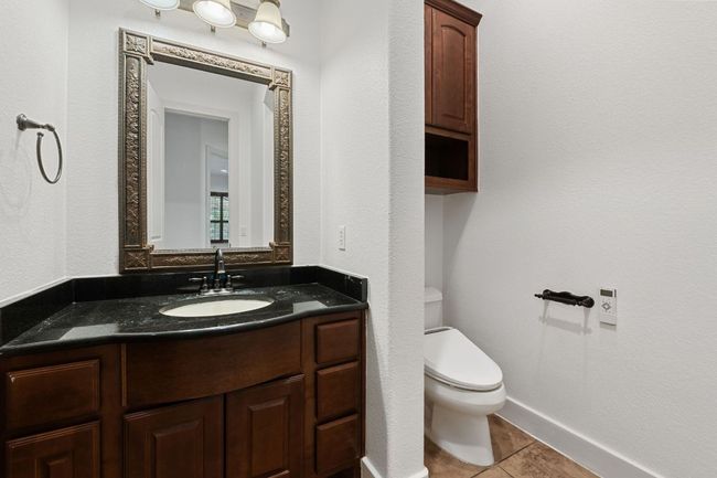 Bathroom featuring vanity and tile patterned flooring | Image 4