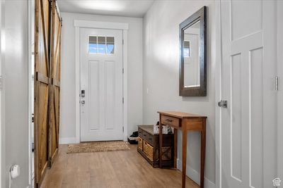 Foyer entrance with light hardwood / wood-style flooring | Image 3