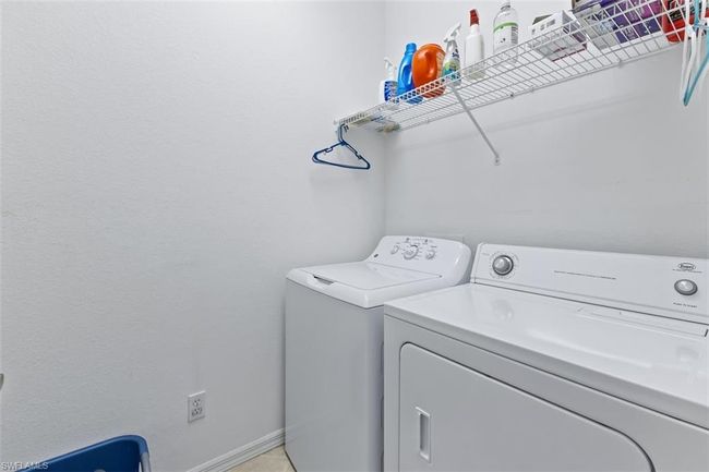 Laundry room featuring washing machine and dryer | Image 25