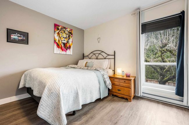 Bedroom featuring wood finished floors and baseboards | Image 16