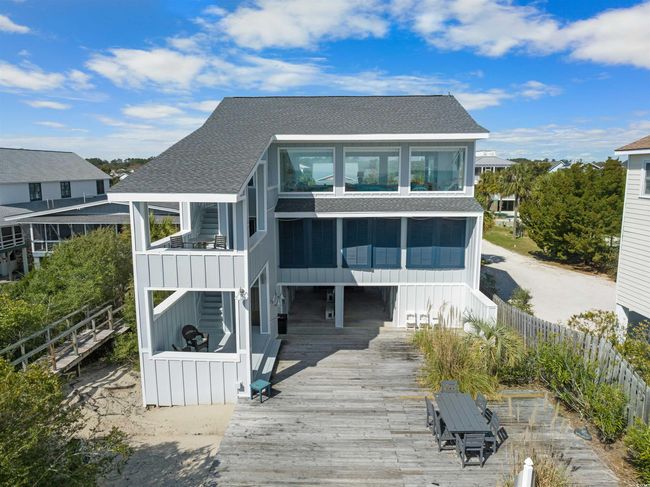 Back of house with a wooden deck and a sunroom | Image 20