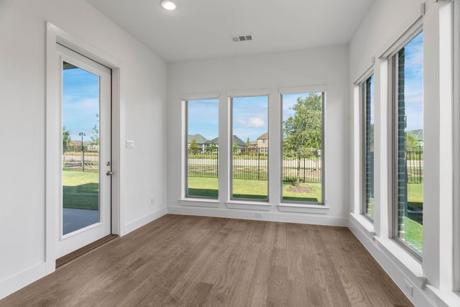 Unfurnished sunroom with wood finished floors, recessed lighting, and baseboards | Image 28