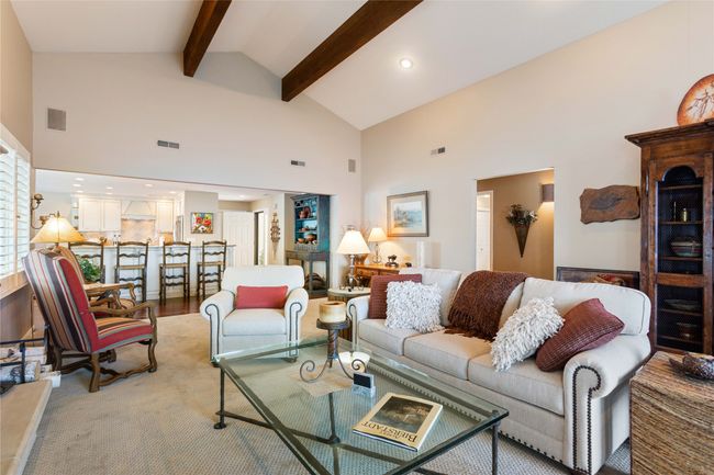 Living room featuring high vaulted ceiling, beamed ceiling, and recessed lighting | Image 47