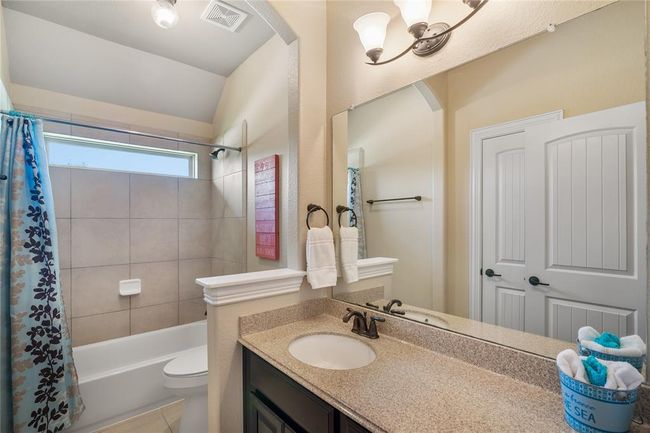 Another fabulous secondary bathroom with bright natural light. | Image 32