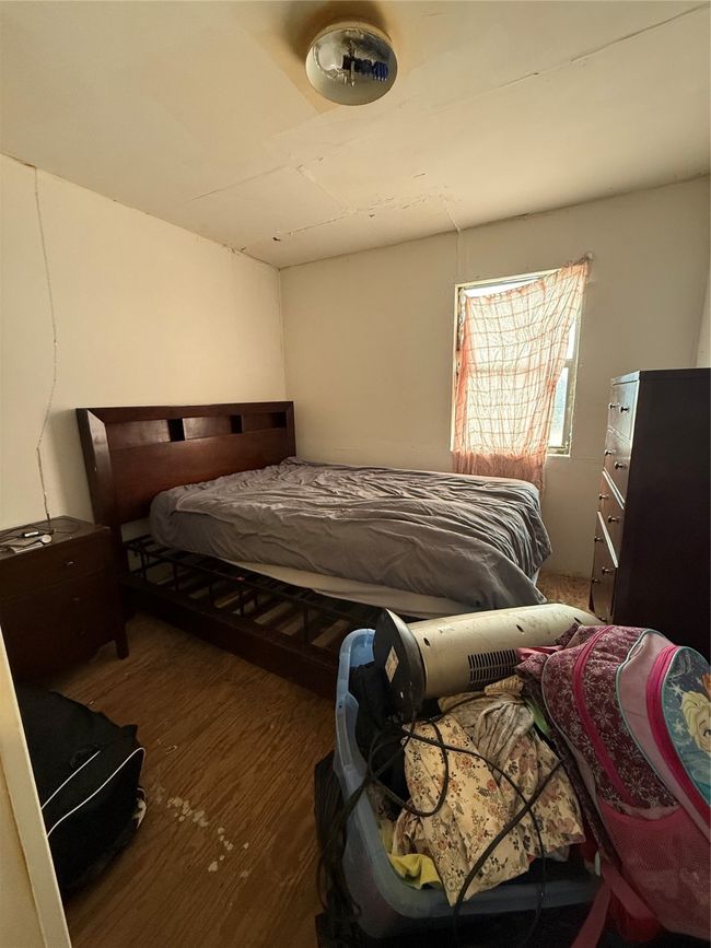Bedroom featuring dark wood finished floors | Image 7