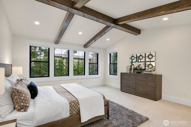 Relax the Night away in the Primary Suite. Note the attention to detail with Hand Stained Accent Beams. | Image 26
