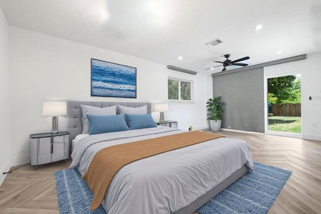 Bedroom featuring multiple windows, visible vents, baseboards, and access to exterior | Image 26