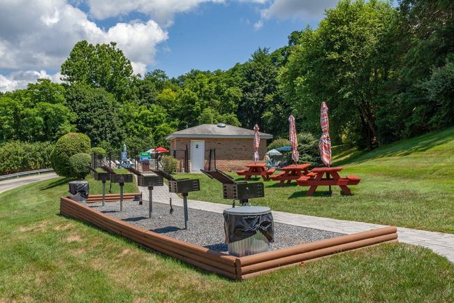 Pool area with outdoor grills | Image 20